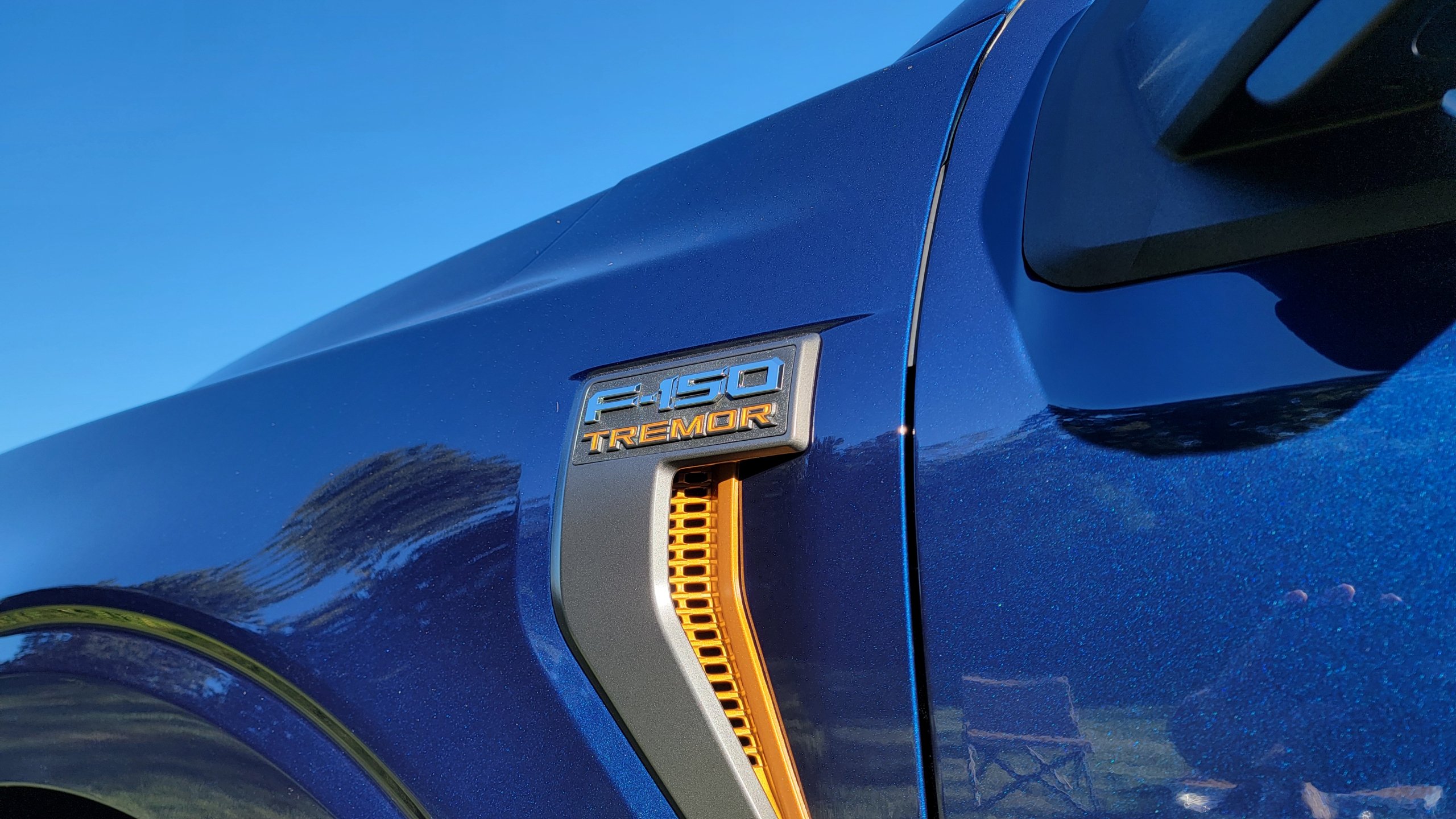 Ford F-150 Tremor badge on blue pickup truck